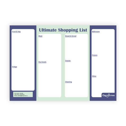 A four-column Ultimate Shopping List planner pad by Deco Formes, featuring purple-blue borders, a light green center background, and white writing areas for groceries, household items, and bathroom essentials.